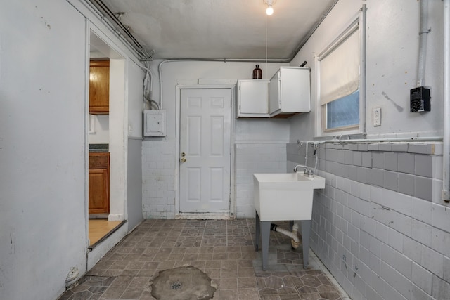 22167 Rausch Ave, Eastpointe, MI 48021 - bathroom with tile walls, electric panel, and wainscoting