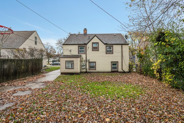 22167 Rausch Ave, Eastpointe, MI 48021 - rear view of house featuring a chimney and a shingled roof