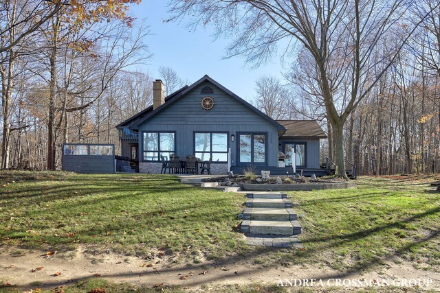 1155 Edgewater Ter, South Haven, MI 49090 - view of front of house with a chimney and a front lawn