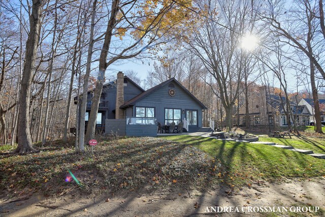 1155 Edgewater Ter, South Haven, MI 49090 - view of front facade featuring a chimney and a front yard