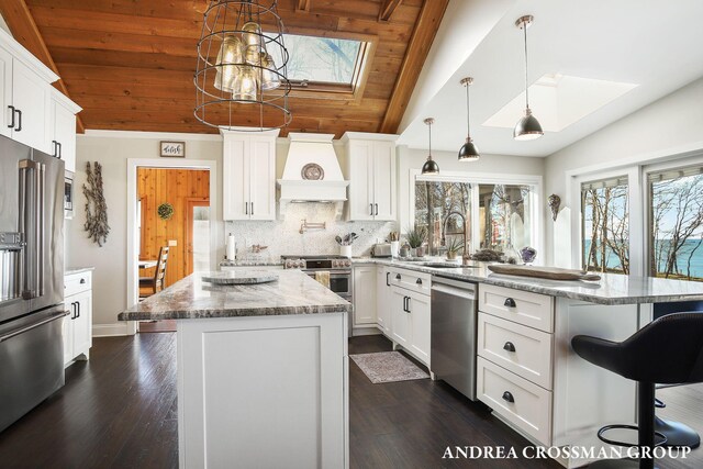 1155 Edgewater Ter, South Haven, MI 49090 - kitchen with stainless steel appliances, premium range hood, a skylight, a peninsula, and wooden ceiling