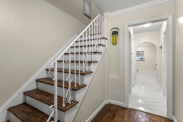 staircase featuring hardwood / wood-style floors