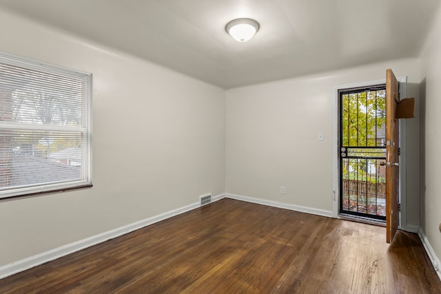 empty room featuring dark hardwood / wood-style floors