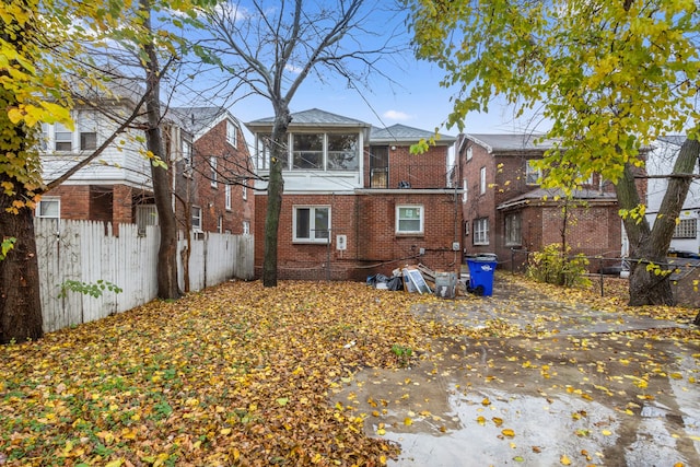 back of property featuring a balcony