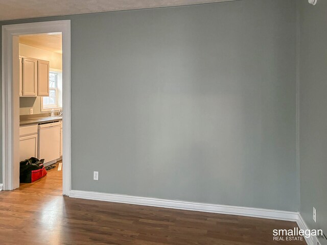 unfurnished room with light hardwood / wood-style floors