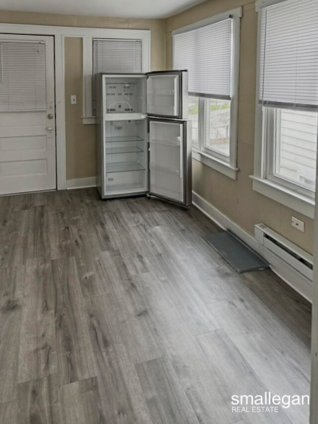 interior space featuring hardwood / wood-style floors and a baseboard radiator