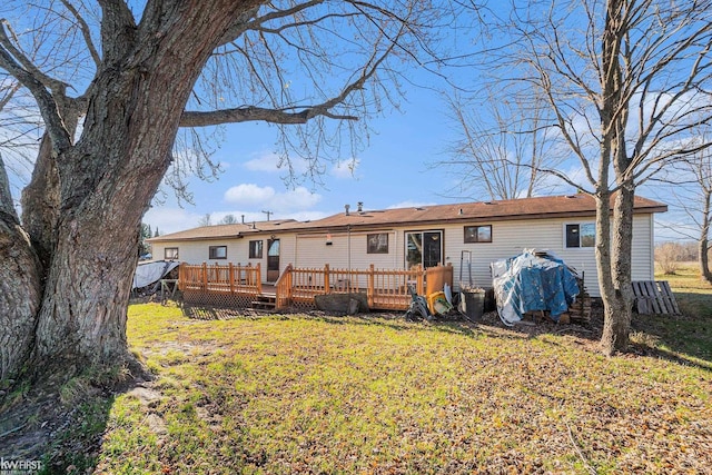 470 Michelson Rd, Houghton Lake, MI 48629 - rear view of house with a wooden deck and a yard