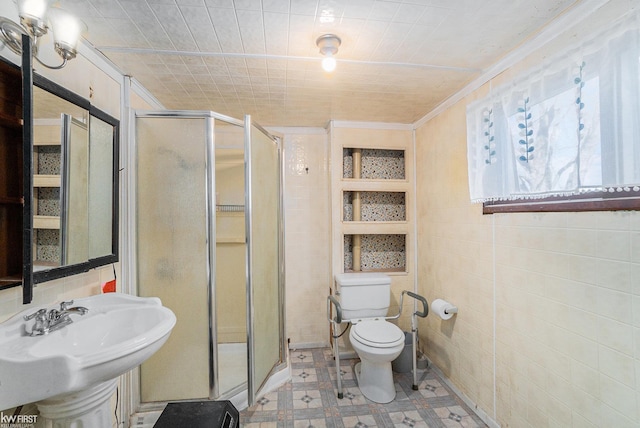 470 Michelson Rd, Houghton Lake, MI 48629 - bathroom featuring ornamental molding, a stall shower, tile patterned floors, toilet, and tile walls