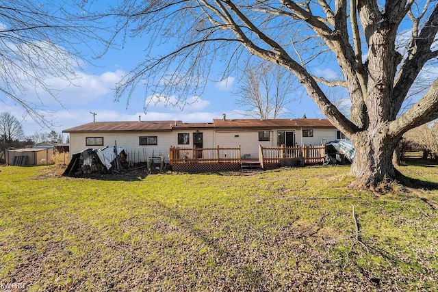 470 Michelson Rd, Houghton Lake, MI 48629 - rear view of house featuring a deck and a yard