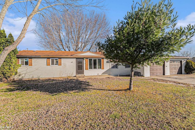 470 Michelson Rd, Houghton Lake, MI 48629 - ranch-style home featuring concrete driveway, a front yard, a garage, and entry steps
