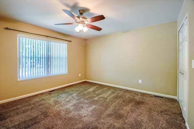 unfurnished room featuring carpet flooring and ceiling fan