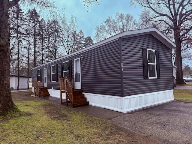 view of home's exterior featuring a yard