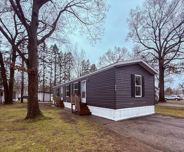 view of property exterior featuring a yard