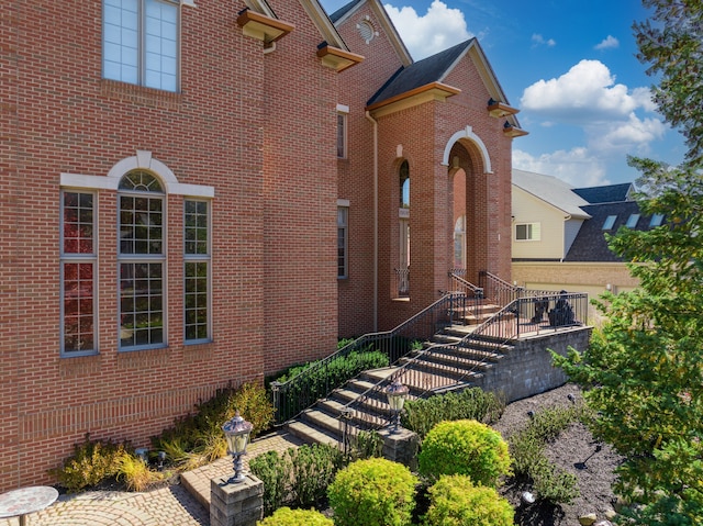 exterior space with brick siding