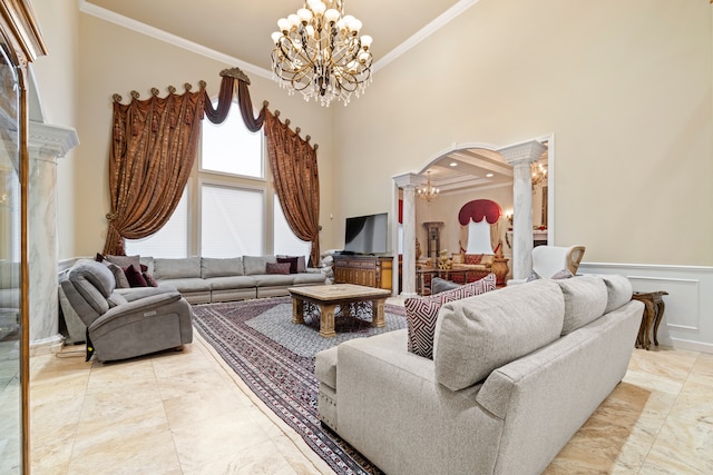 living room with an inviting chandelier, crown molding, and arched walkways