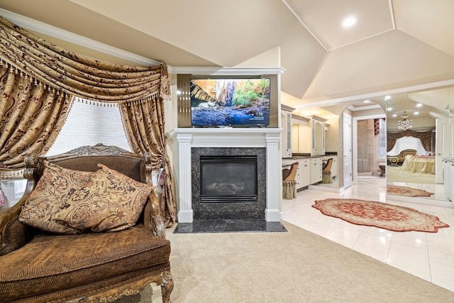 living area featuring recessed lighting, arched walkways, light tile patterned floors, a premium fireplace, and light colored carpet