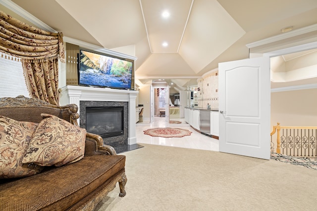 living room with recessed lighting, light carpet, a fireplace, and vaulted ceiling