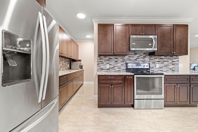 kitchen with dark brown cabinetry, ornamental molding, light stone counters, decorative backsplash, and stainless steel appliances