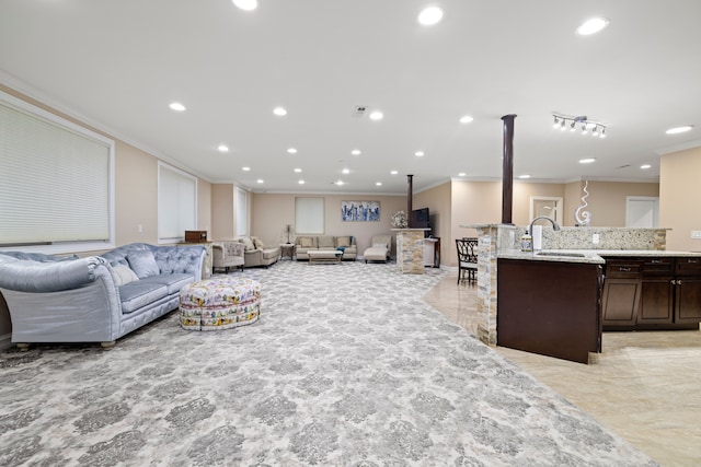 living room featuring recessed lighting and crown molding