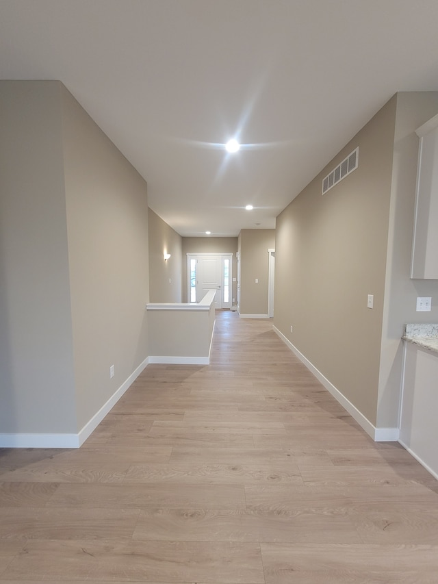 unfurnished room with light hardwood / wood-style flooring