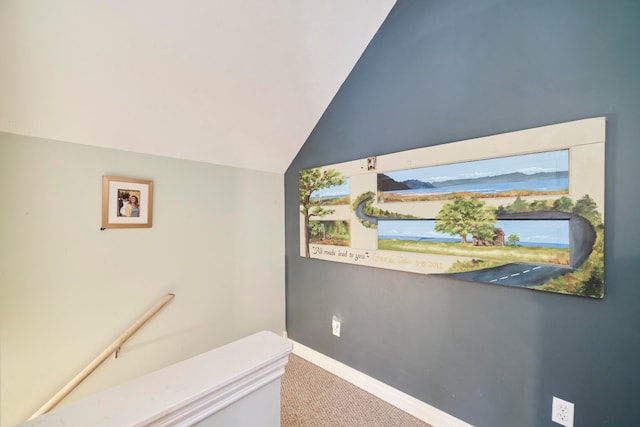 interior space featuring carpet and lofted ceiling