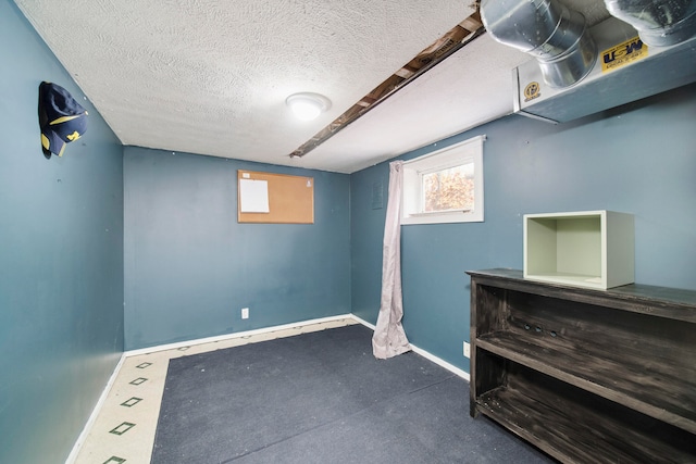 basement with a textured ceiling