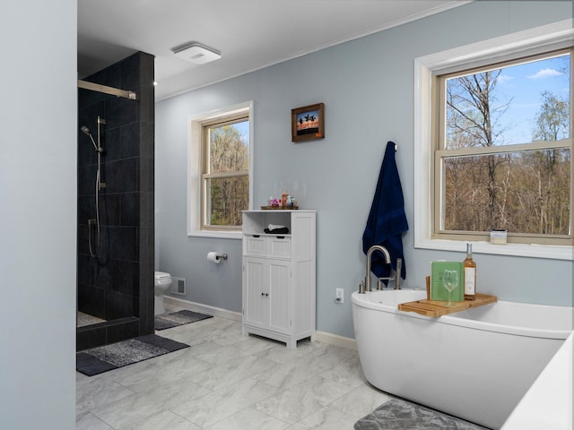 full bathroom featuring a healthy amount of sunlight, toilet, and shower with separate bathtub