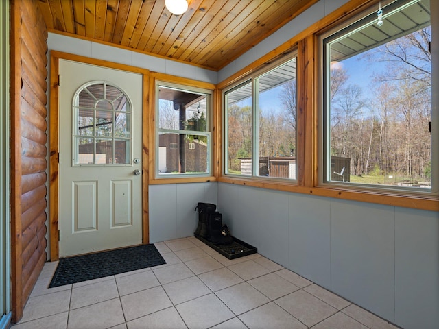 unfurnished sunroom with wood ceiling