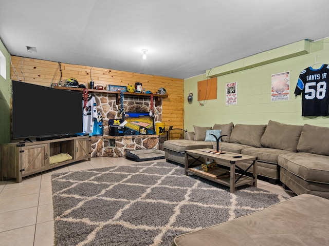 tiled living room featuring wooden walls