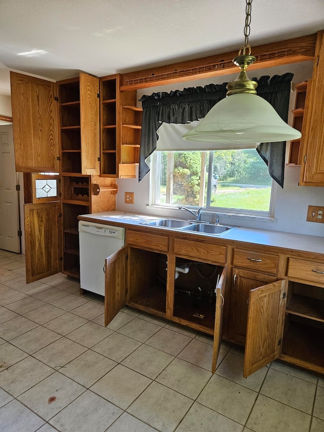 kitchen with white dishwasher, light tile patterned flooring, sink, and hanging light fixtures