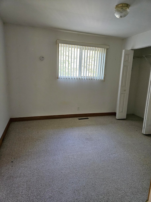 unfurnished bedroom featuring carpet flooring