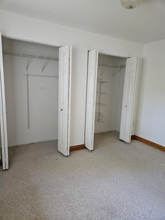 unfurnished bedroom with light carpet