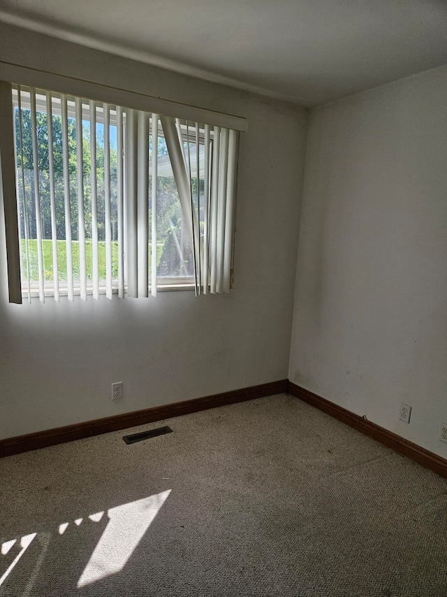 unfurnished room with carpet floors