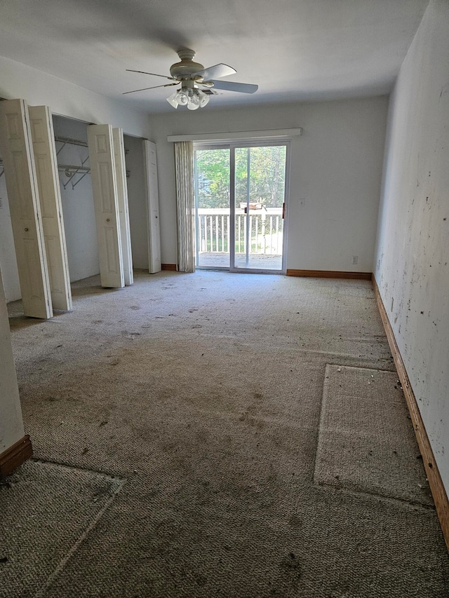 spare room with carpet flooring and ceiling fan