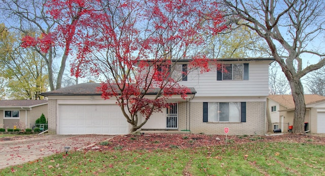 view of front facade with a garage and a front lawn