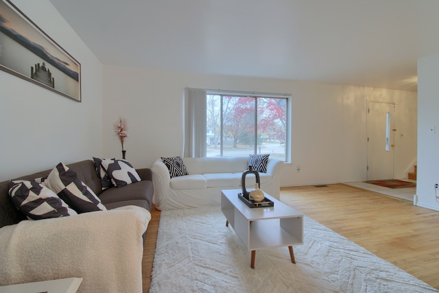 living room with light hardwood / wood-style flooring