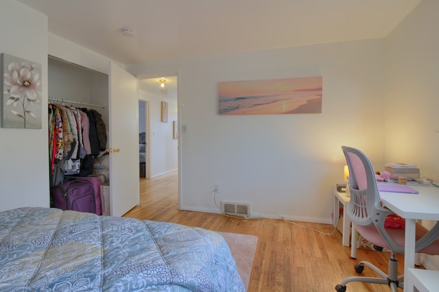 bedroom with a closet and light wood-type flooring