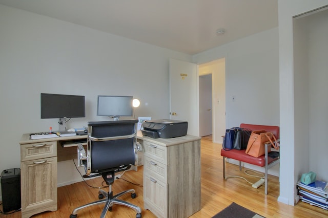 office space with light hardwood / wood-style floors