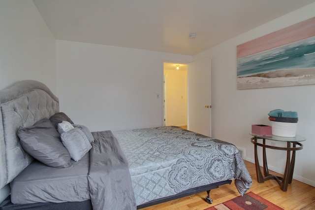 bedroom with hardwood / wood-style flooring