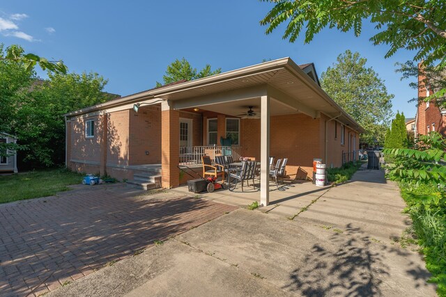 view of front facade with a patio area, ceiling fan, and covered porch