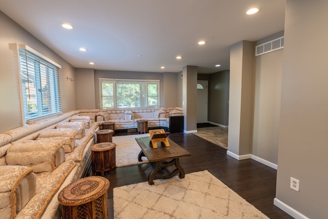 living room with dark hardwood / wood-style floors