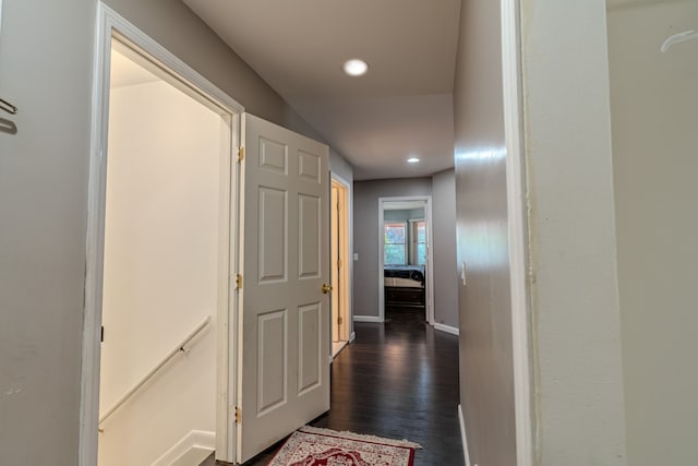 hallway featuring dark hardwood / wood-style flooring