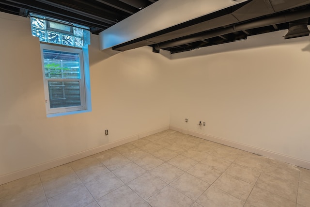 basement with light tile patterned flooring