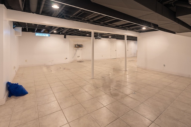 basement featuring light tile patterned floors