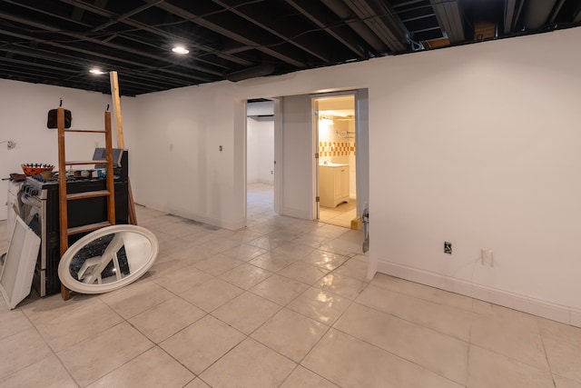 basement featuring light tile patterned floors