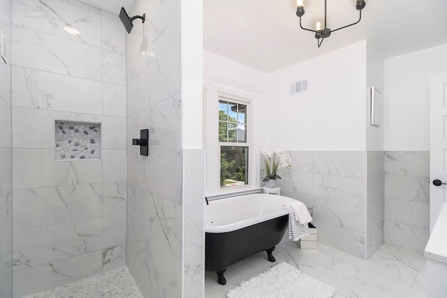 bathroom with separate shower and tub and tile walls