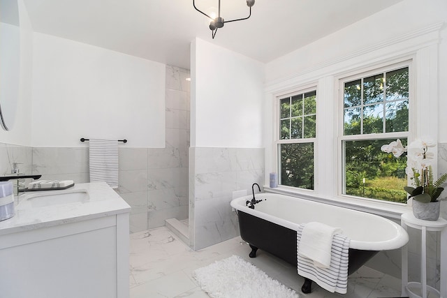 bathroom with vanity, tile walls, and plus walk in shower