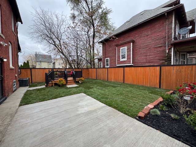 view of yard featuring a wooden deck