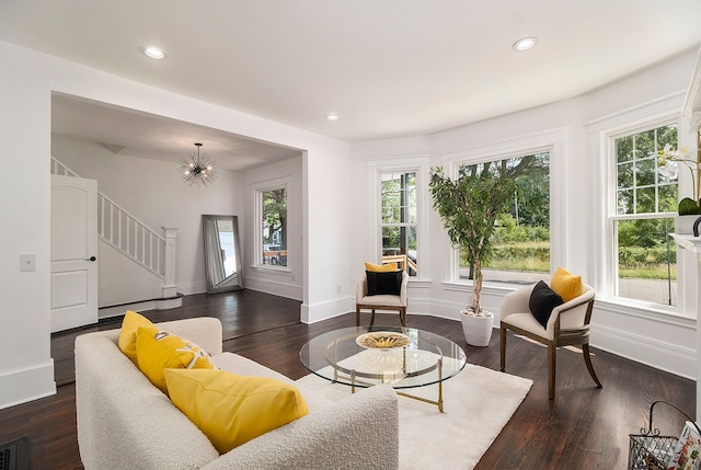 living room featuring dark hardwood / wood-style flooring and plenty of natural light