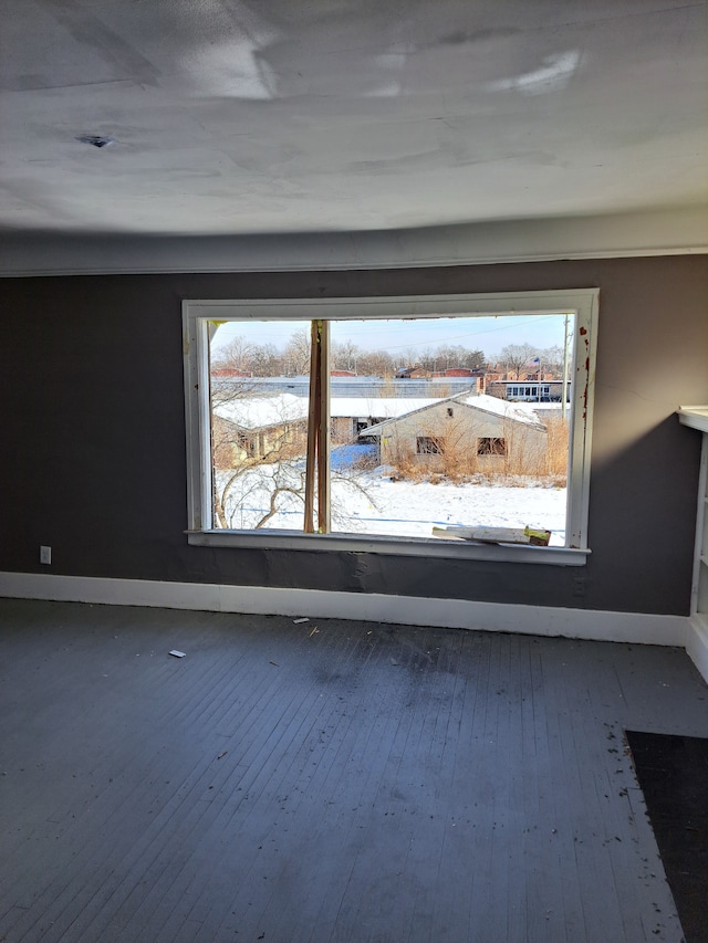 interior details with wood finished floors and baseboards